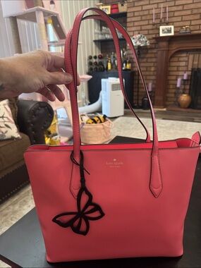 kate spade coral-pink tote with butterfly charm